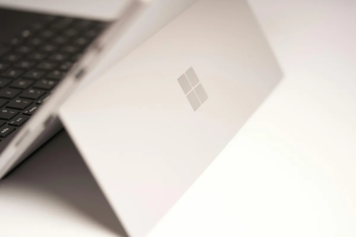 White laptop computer on white table