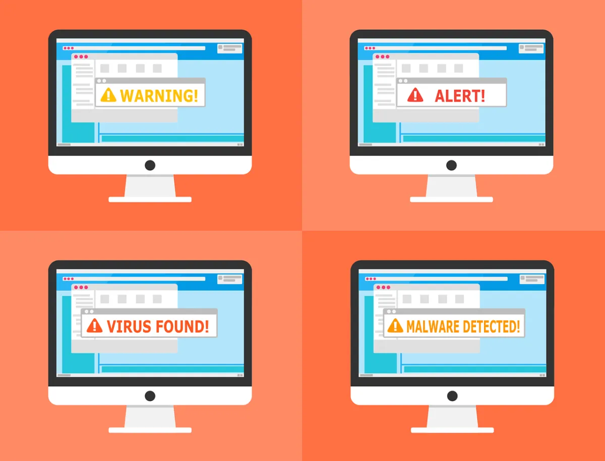Warning alerts on the screen of four computers.