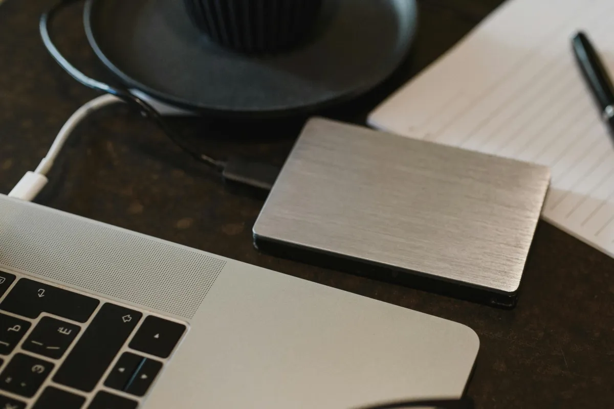 Portable drive connected to a laptop.
