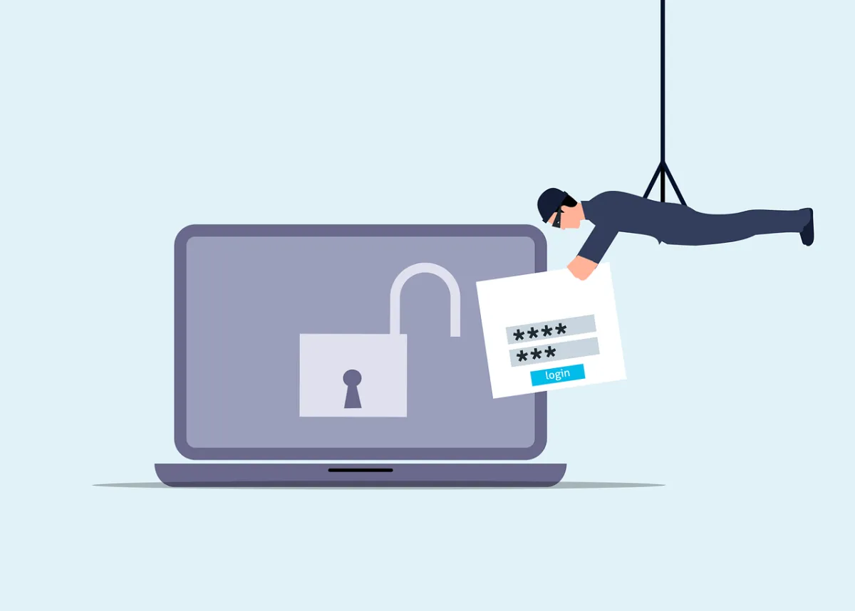 A cartoon laptop with a robber stealing login details.