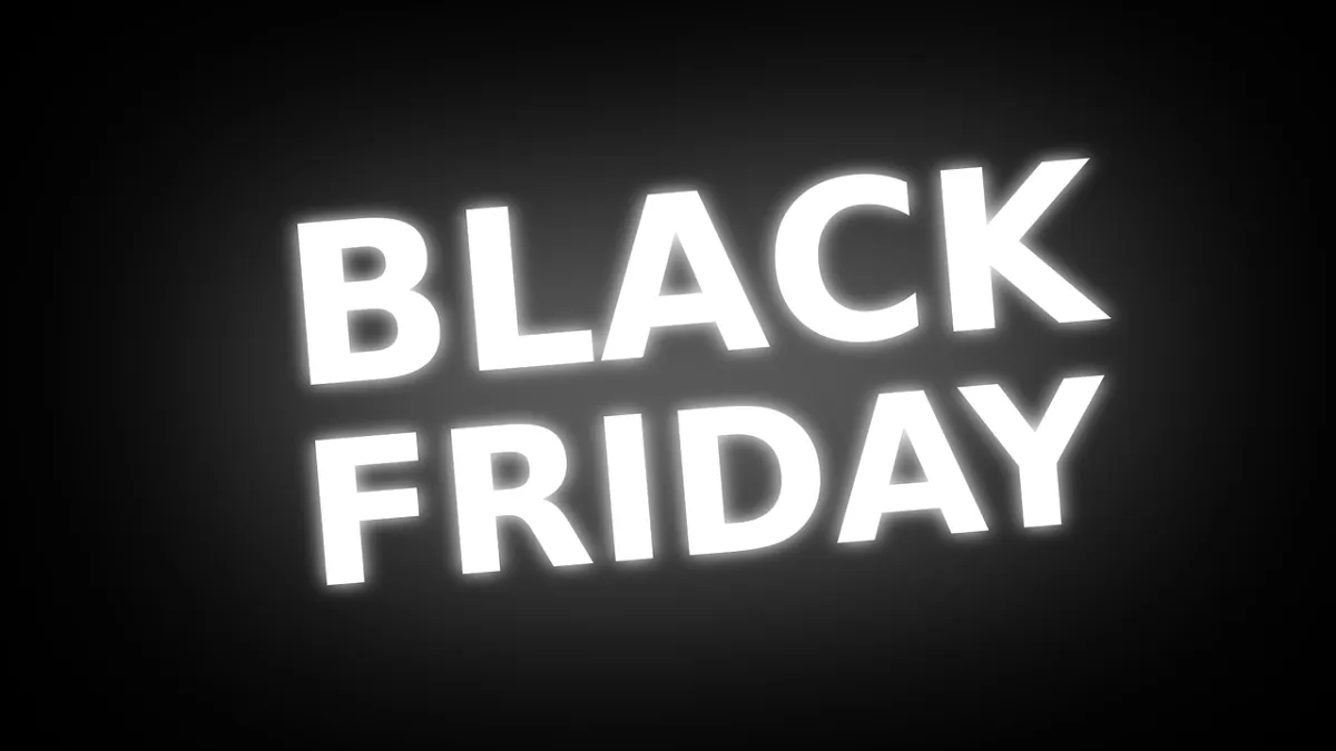 A dark background with white neon lettering that says "BLACK FRIDAY".