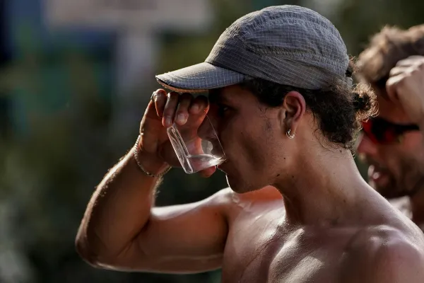 Athlete tracking water intake with Grip Hydra, showing measurement and accountability