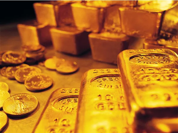 Golden bars and coins on display, metaphor for investing in knowledge, skills, and personal growth