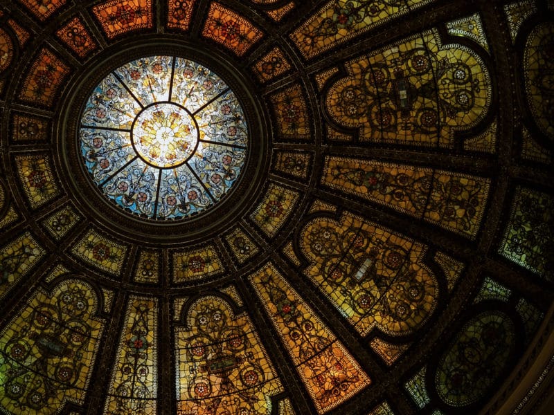 The Benefit of all Concerned like a ceiling of stained glass that compliments all the pieces