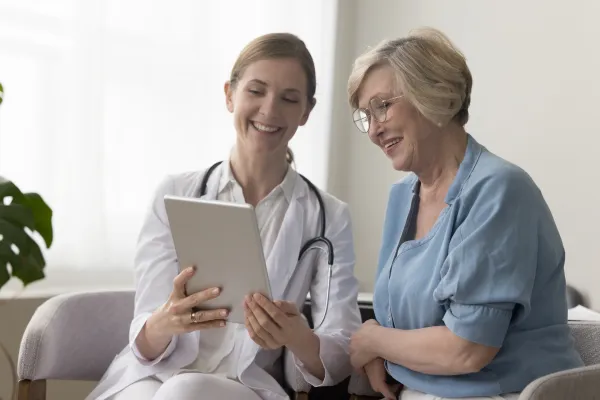 Patient leaving a positive review for a healthcare clinic on a mobile phone.