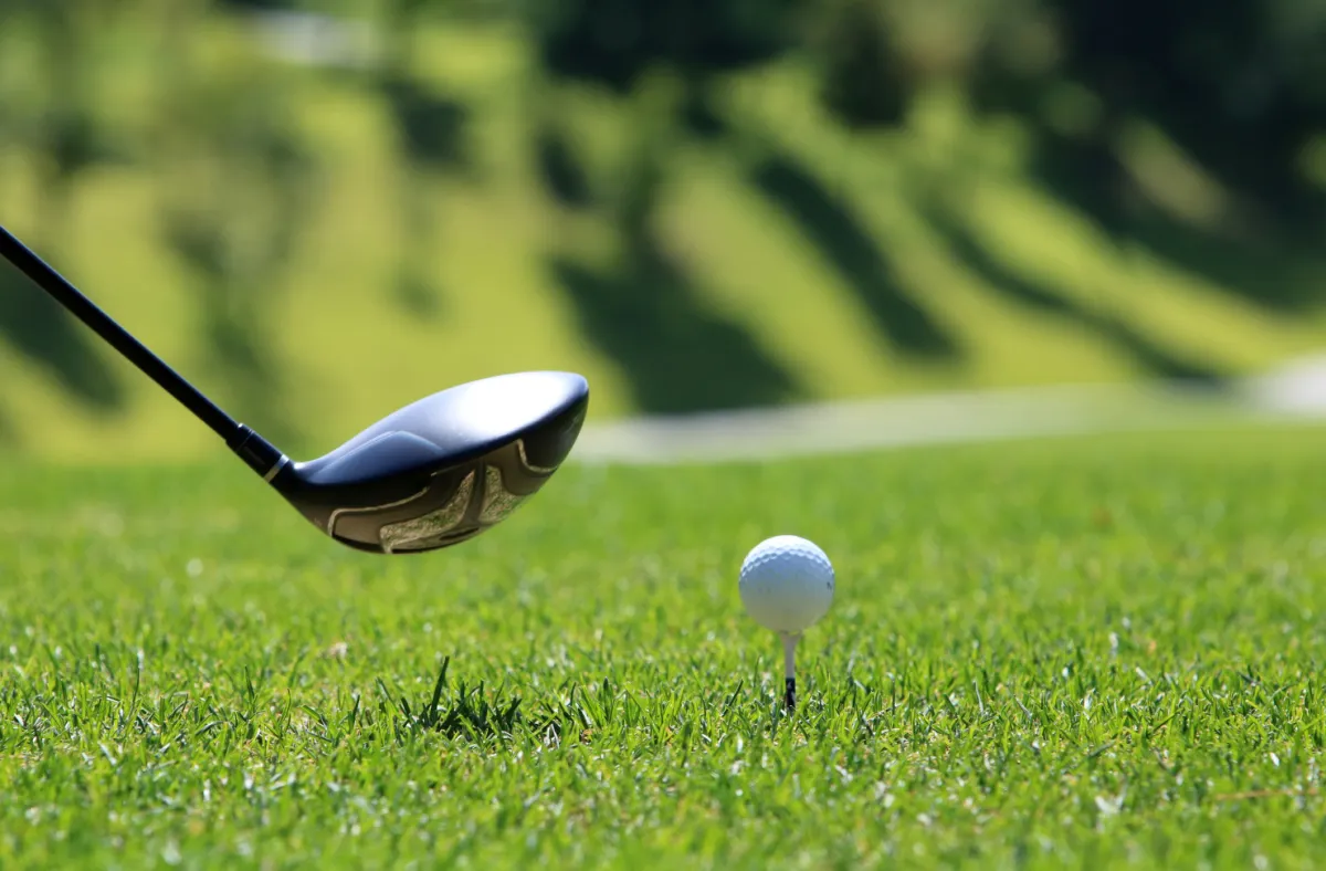 A golfer preparing to hit a ball