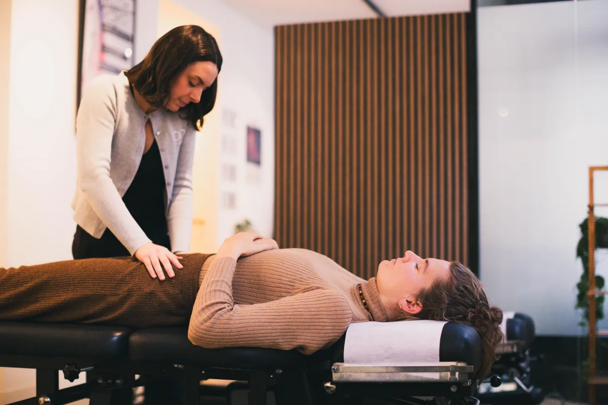 someone having their nervous system adjusted to help with digestive issues