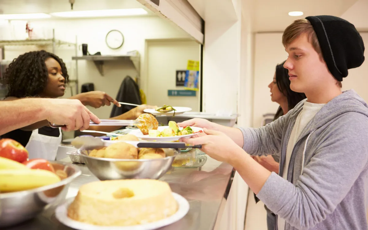 Serving dinner to youth