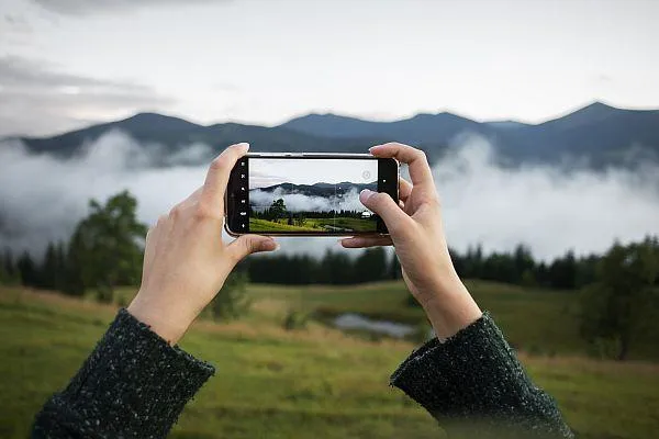 Woman taking cell phone photo