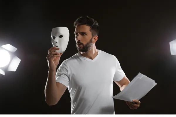 Man holding a mask in front of him
