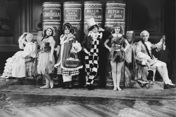 Various characters in front of books