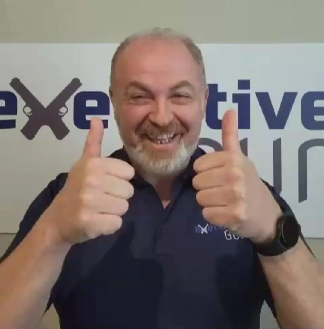 NRA Certified Instructor Joe Yagar smiling with two thumbs up