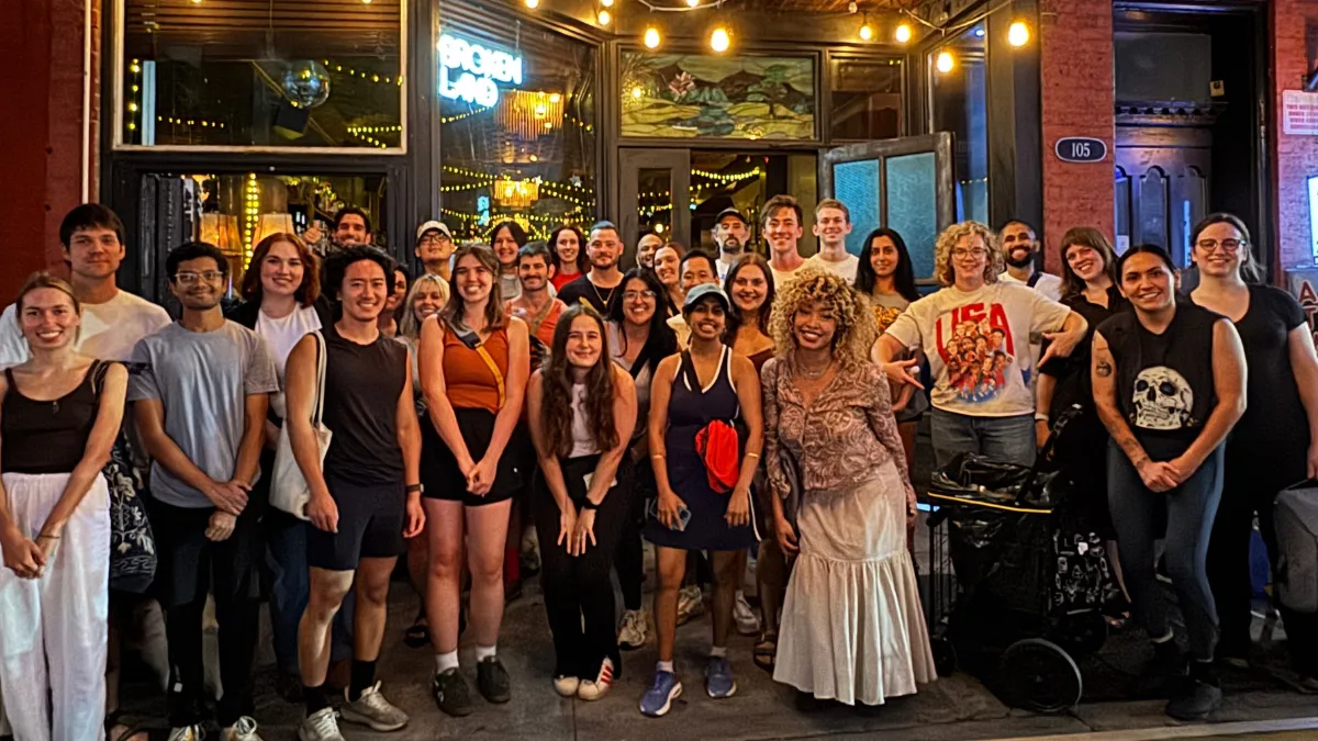 Greenpoint Trash Club volunteers with grabbers and trash bags cleaning Brooklyn streets together