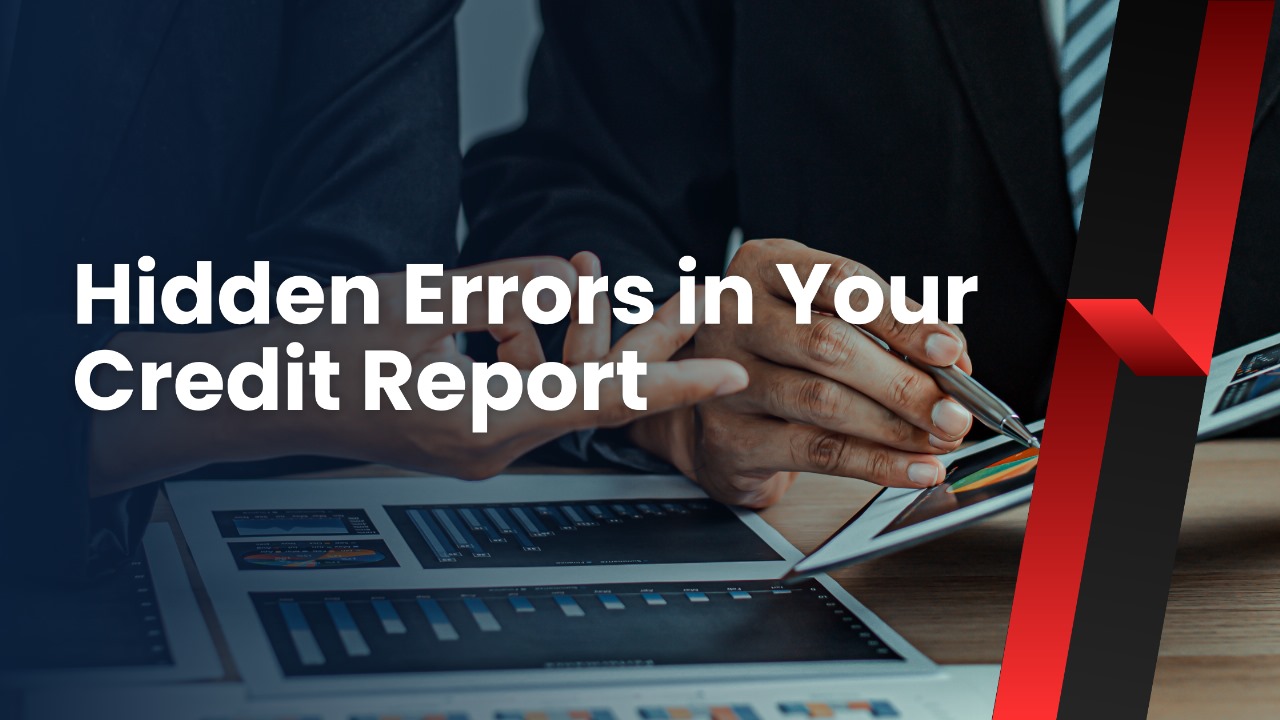  An image featuring two individuals in business attire, looking at financial charts and graphs displayed on a tablet and paper reports on a desk. The focus is on the hands of one person pointing to the tablet screen with a stylus, and the other person's hand pointing at the reports. The text "Hidden Errors in Your Credit Report" is overlaid in large white font on the dark, blue-toned image. The overall setting suggests a financial or business meeting.