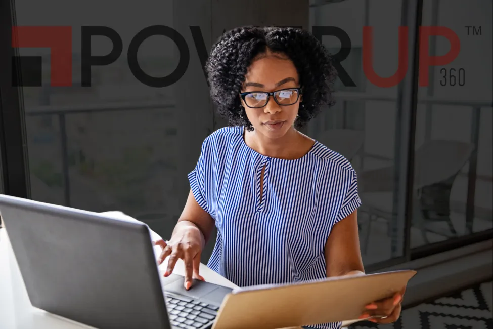 African woman being productive using laptop with glasses