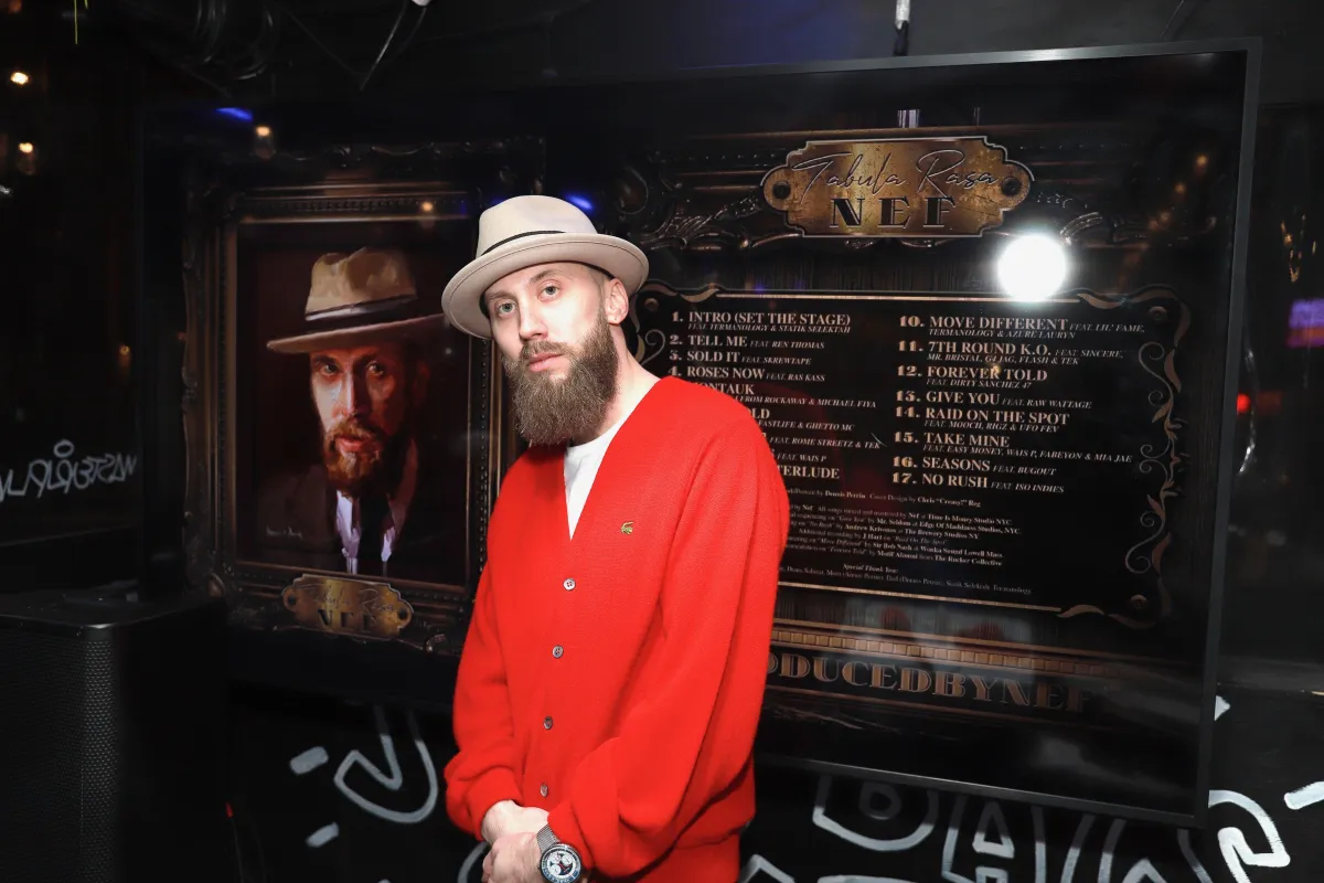 Produced by Nef working in the studio, symbolizing his journey from New Hampshire to the hip hop industry’s elite circles