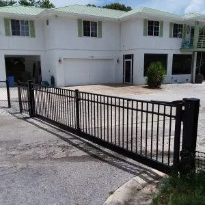 Black aluminum driveway gate installation in Bradenton for secure and stylish property entrance.