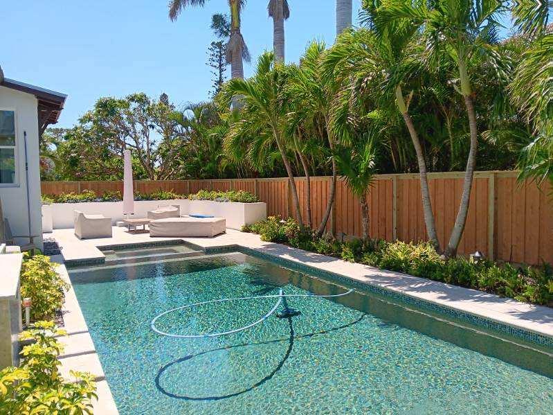 Sarasota wood pool fence installation for backyard privacy and safety.