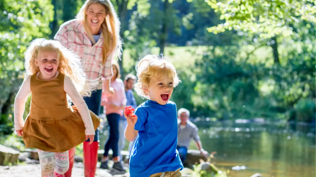 Family walking at Gray's Lake enjoying natural health habits