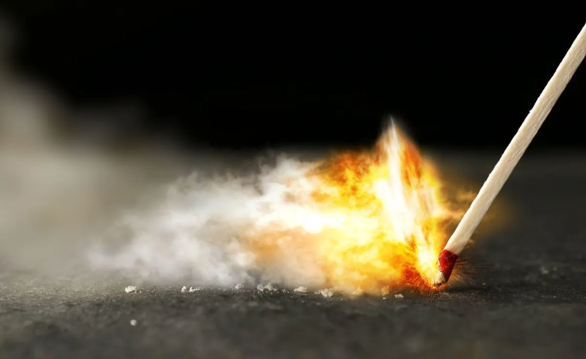 lighting a match