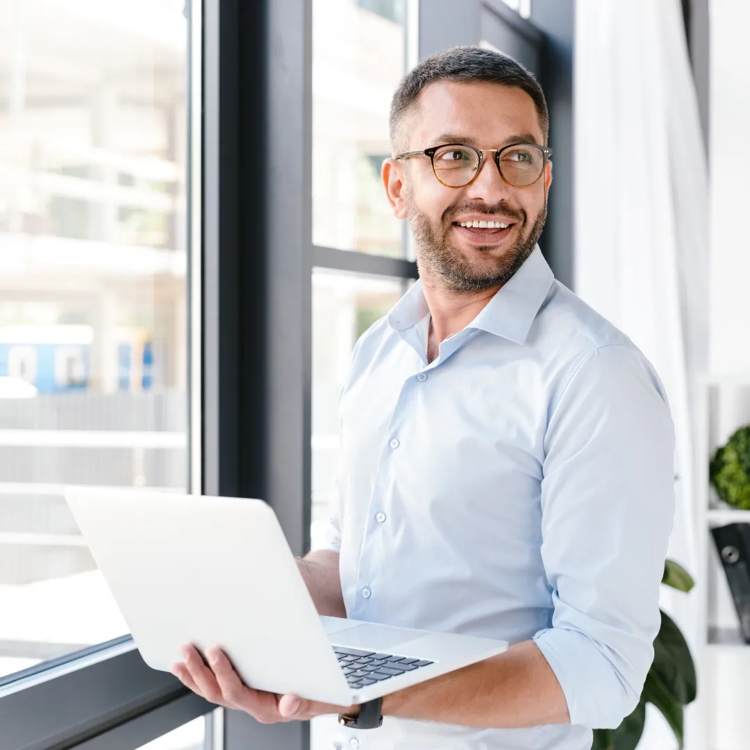 a man holding a laptop