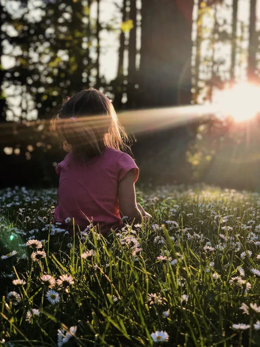 A woman in nature with a ray of light