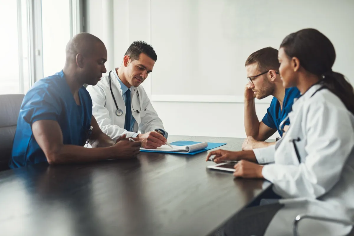 group of workers meeting around a table