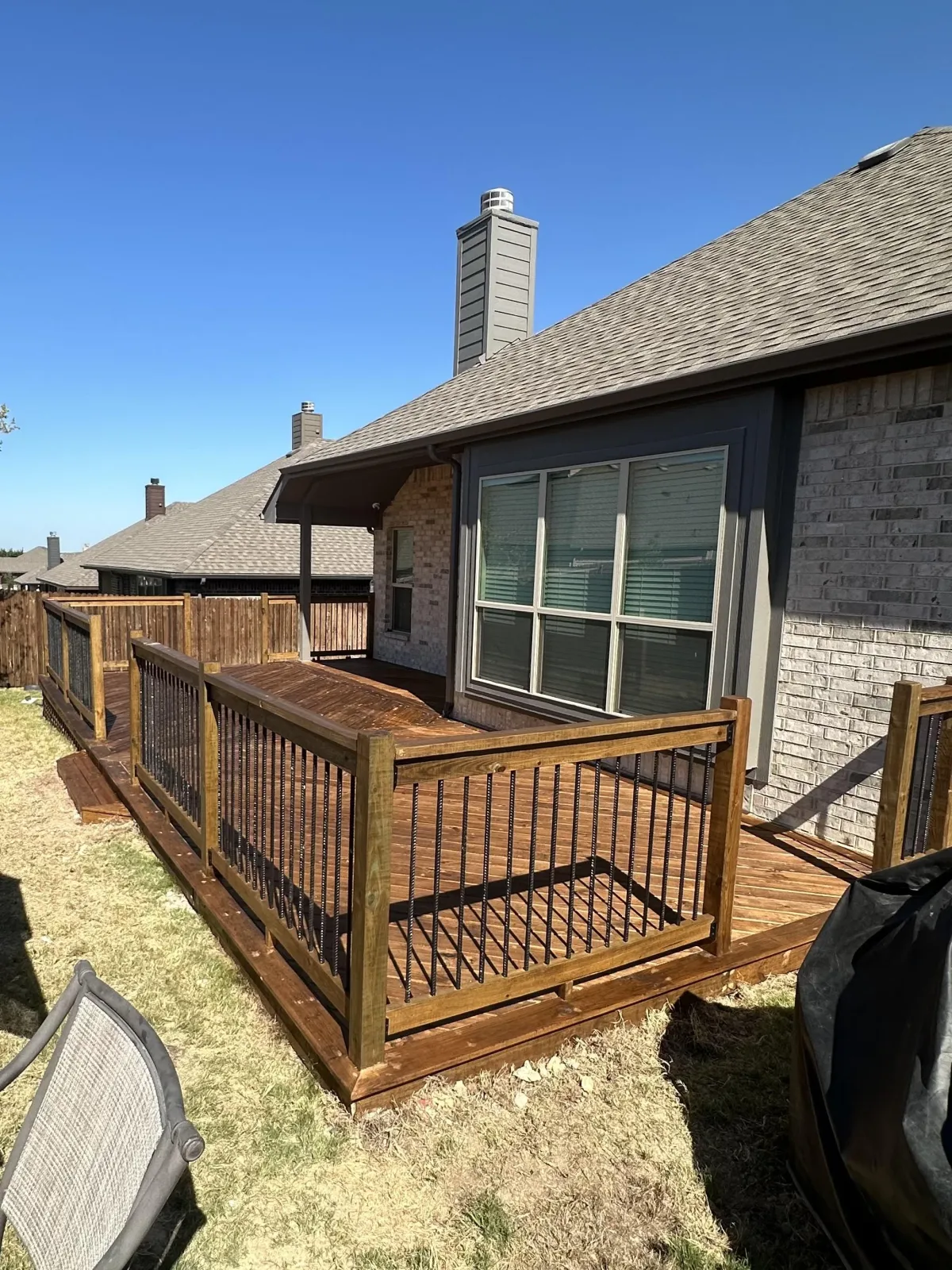 Stained outdoor deck with clean finish and durable hardware