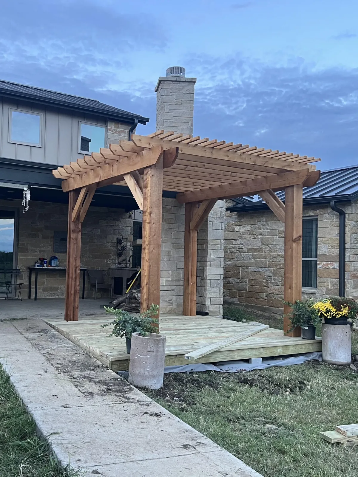 Outdoor wood structure with hex lattice overhead and open-air design