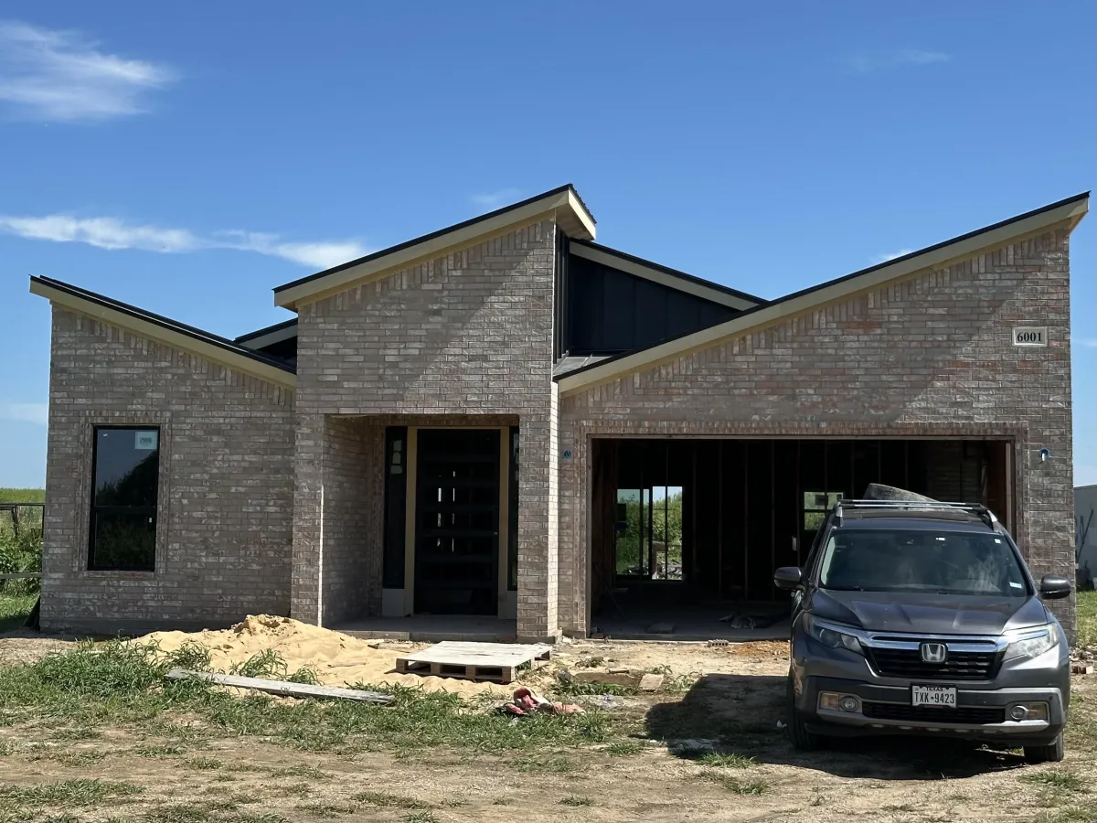 New home build in progress showing framing and early construction stages
