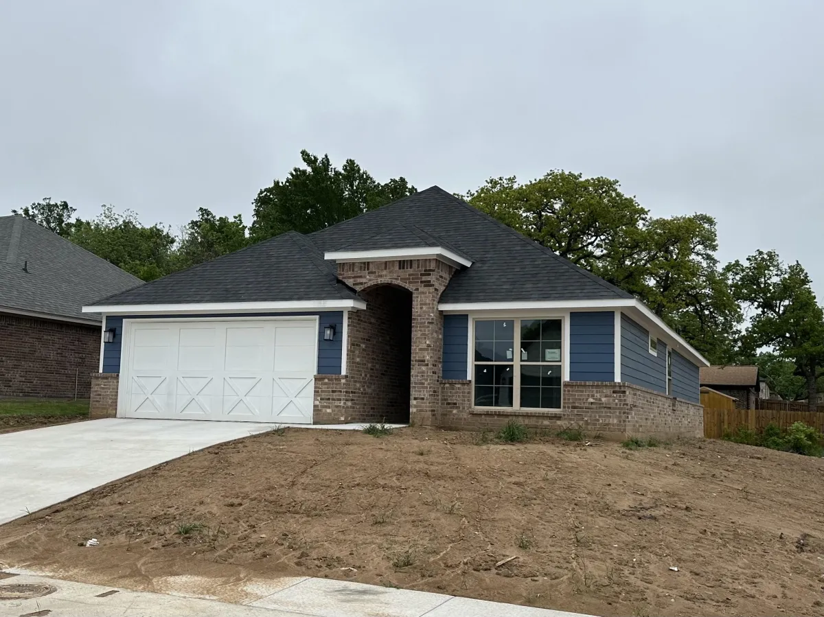 Completed new construction home exterior with finished siding and trim details