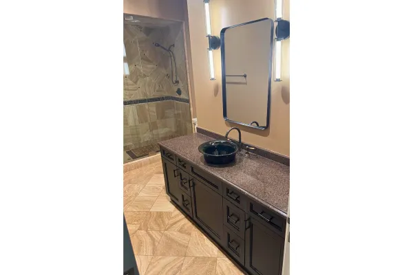 Modern bathroom remodel with walk-in shower, floating vanity, and matte black fixtures – Chicago home