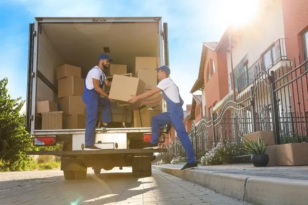 Professional movers in Halifax carefully loading furniture into a moving truck for a stress-free relocation.
