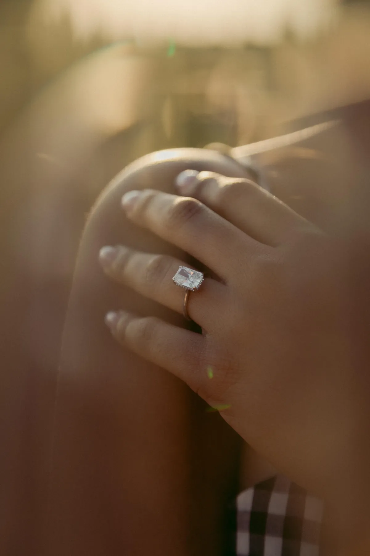 close up of a gold ring with a diamond stone set in the middle