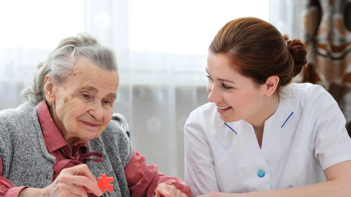 senior with dementia along with her daughter