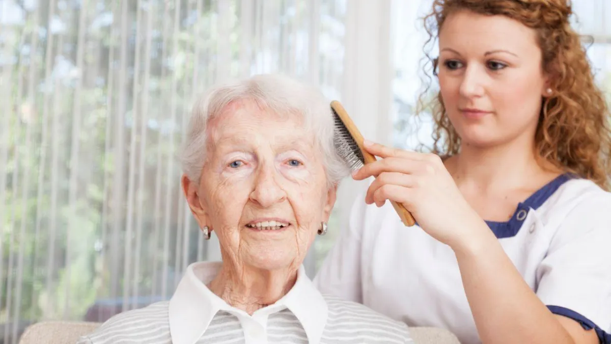 a senior with dementia helping with her daughter in grooming