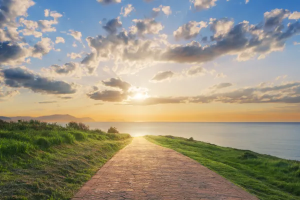 Road leading forward under a clear sky, symbolizing clear direction