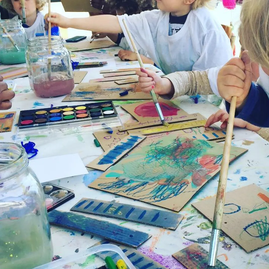 Children painting and creating colourful arts and crafts at Creative Bees Club