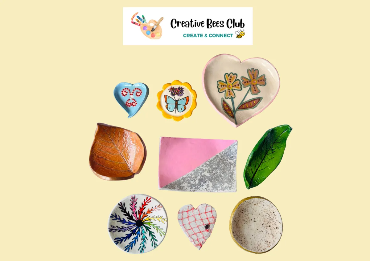 Collection of handmade clay trinket dishes, each with a unique shape and finish