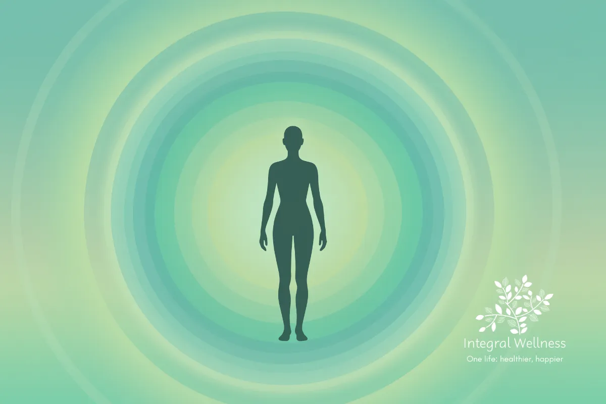 Silhouette of a human figure surrounded by concentric green and teal gradients, symbolizing calm and balance, with the Integral Wellness logo and tagline 'One life: healthier, happier' in the corner.