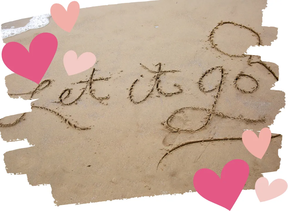 Let go written in the sand symbolizing emotional healing, releasing the past, and moving forward during perimenopause