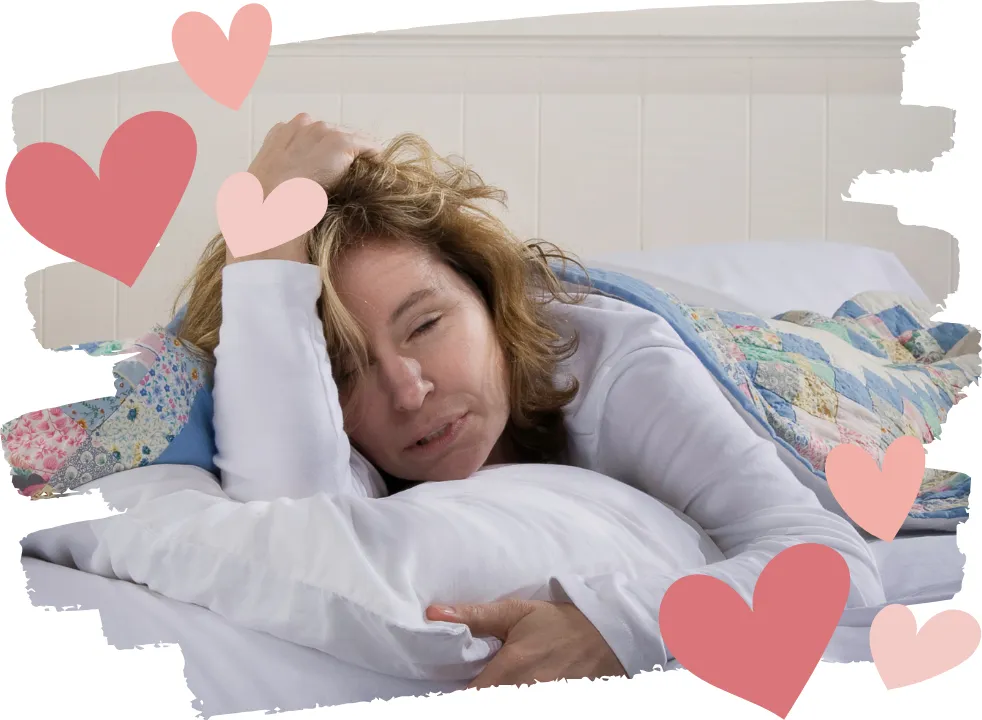 Middle-aged woman lying in bed looking exhausted and hungover, symbolizing how alcohol affects women differently during perimenopause, causing fatigue, anxiety, and poor sleep.