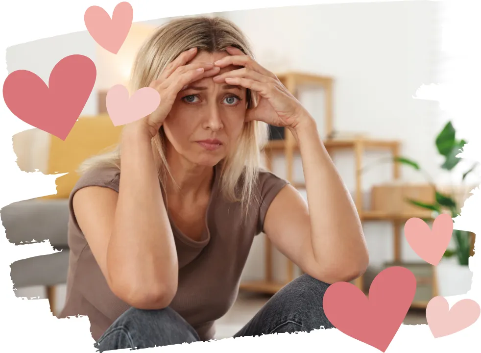 Woman over 40 holding her head in her hands, symbolizing why everything feels harder in midlife