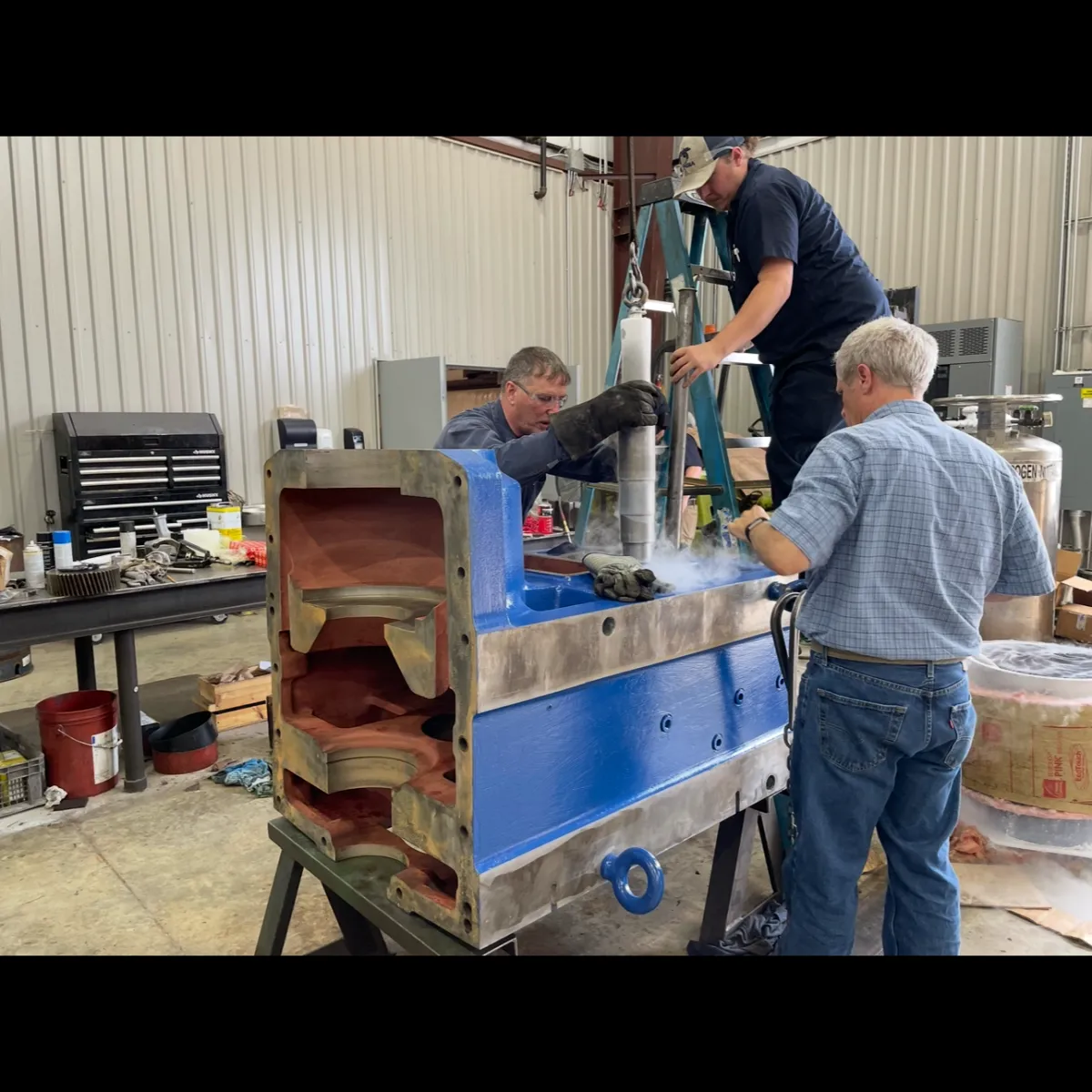 a photo of the IMS team working on a mining drill