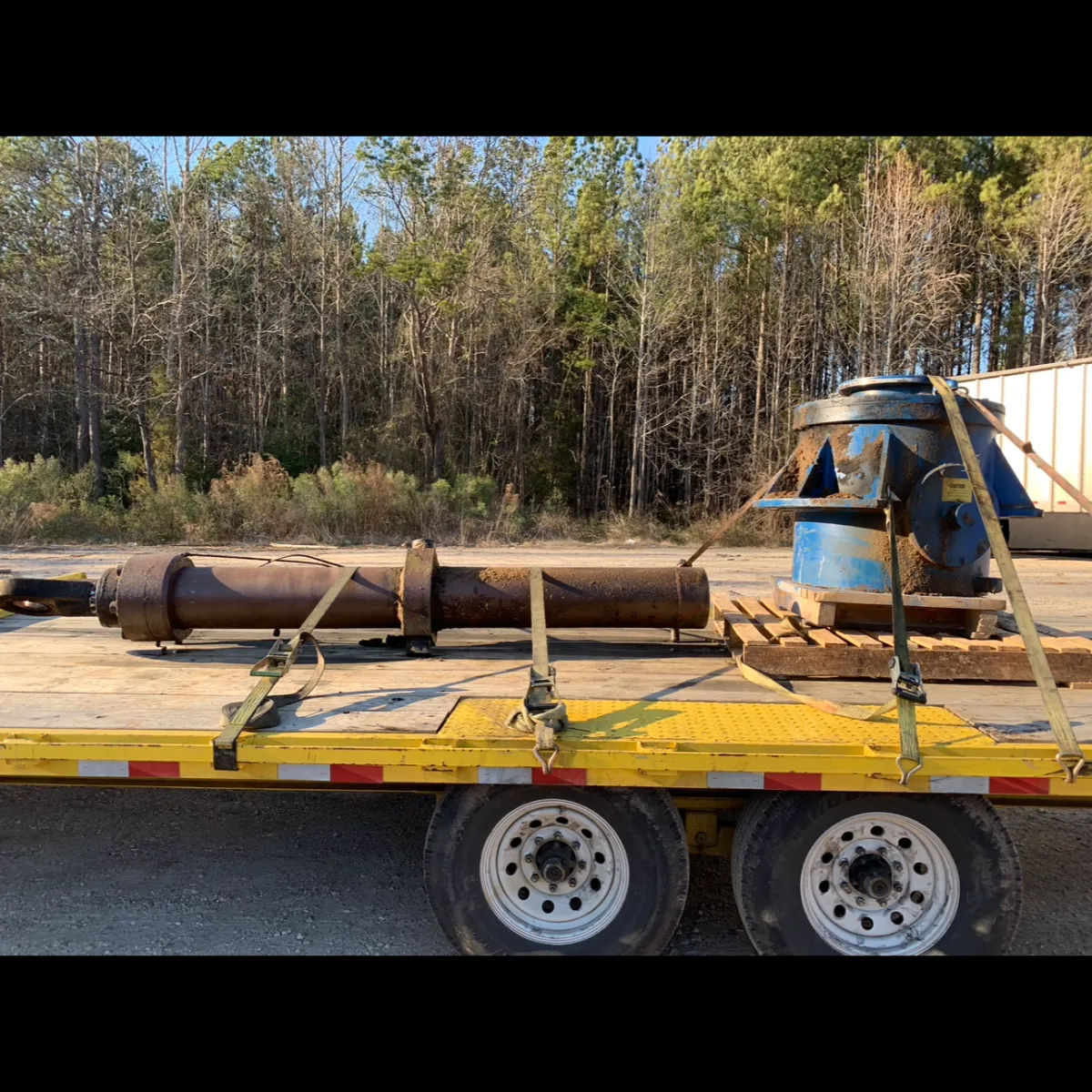 a photo of old rusted equipment on the back of a trailer