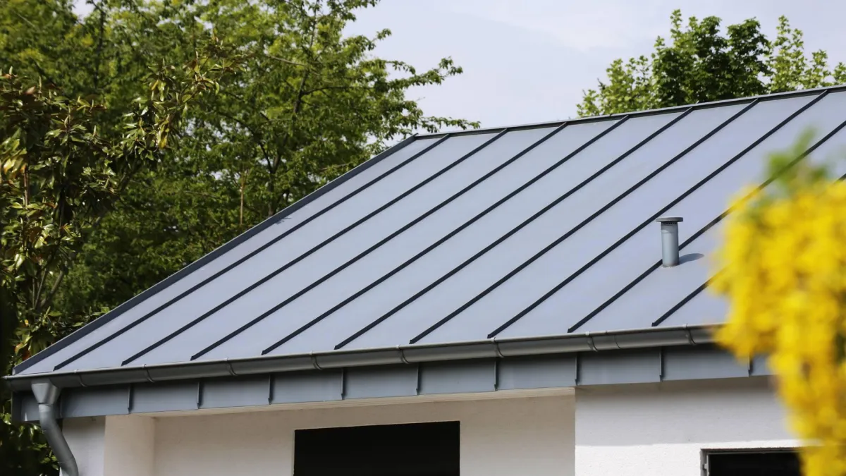 A metal roof is displayed with sleek lines, demonstrating a reliable Florida roofing option.