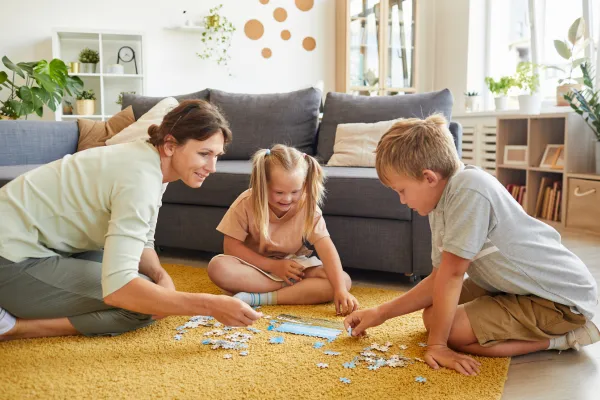 Family puzzling together, laughing