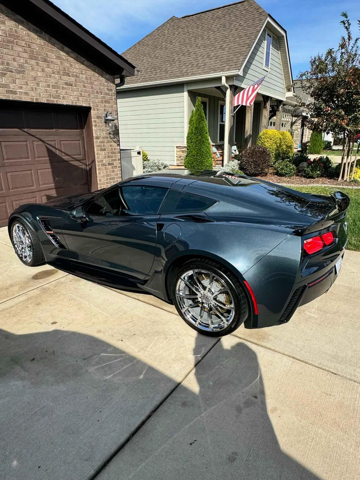 Gray Corvette gleaming after full detail, located near Lake Norman shoreline around Mooresville, NC.