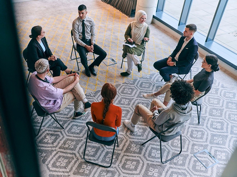 student at a meeting