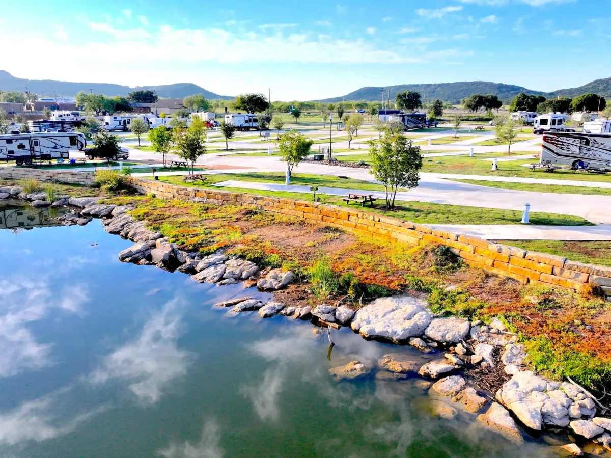 RV sites with concrete pads overlooking Possum Kingdom Lake with boats in the background
